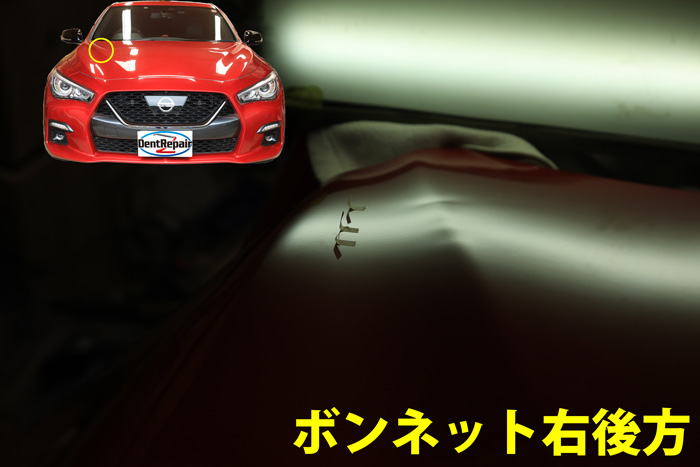 スカイラインボンネットのへこみ、修理前の写真
