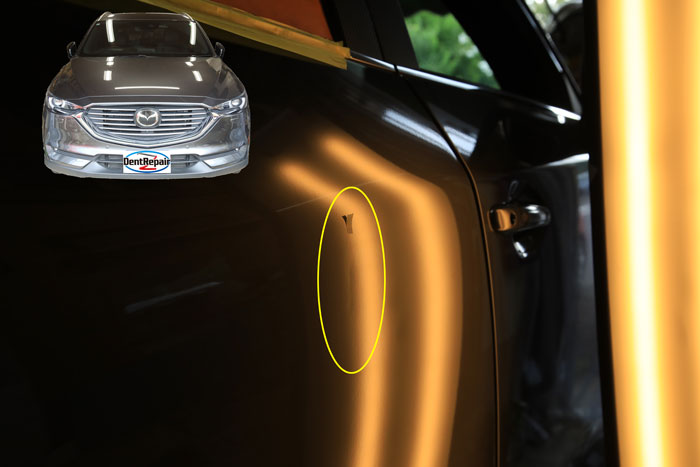 ＣＸ－８リアドアのへこみ、修理前の写真